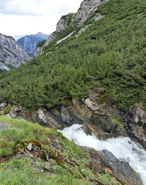 Water flowing through the mountains , beautiful nature background