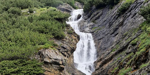 Water flowing through the mountains , beautiful nature background