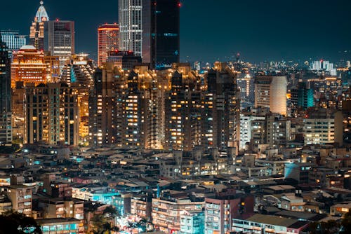 An Aerial Shot of Buildings in a City at Night