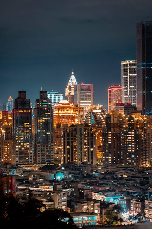 An Aerial Shot of Buildings in a City at Night