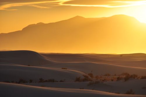 Free Captivating golden sunset over the wavy dunes of White Sands Desert, New Mexico. Stock Photo
