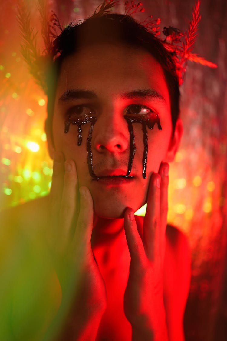 Portrait Of A Man Wearing Dramatic Makeup With Black Tears