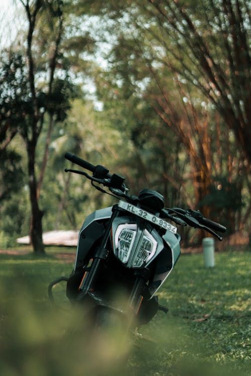 Black Motorcycle Parked on Grass 