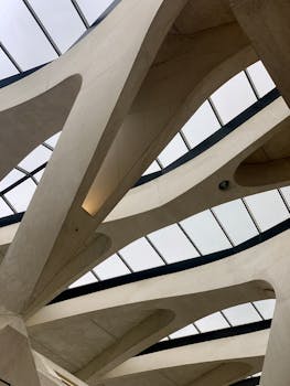 Artistic view of the geometric roofing architecture at Saint Exupery Airport, France.