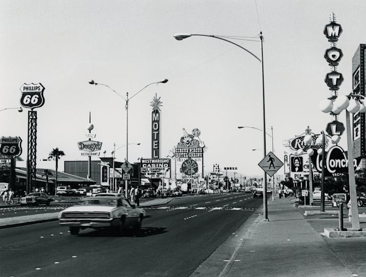 Car And Neon Signs On City Street, Las Vegas, USA