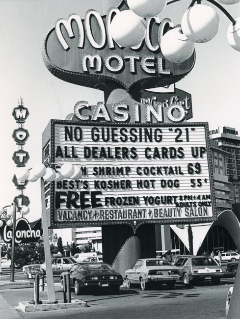 Vintage photo of the Morocco Motel casino sign in Las Vegas, capturing the retro architecture and signage.