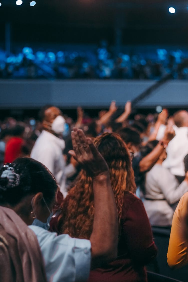 Crowd Of People Praying Together