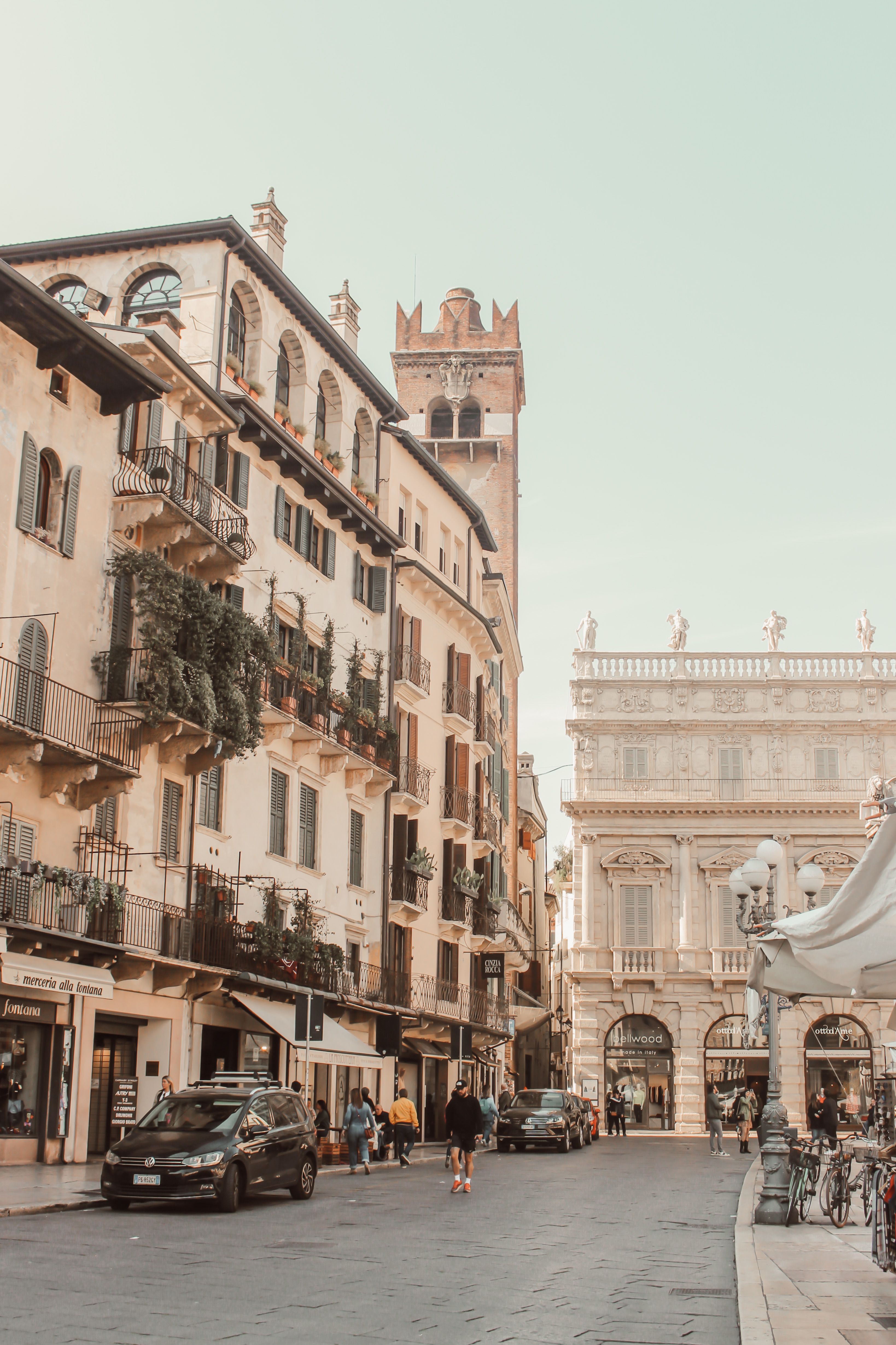 Explore the historic charm of Verona's Piazza delle Erbe with classic architecture and lively atmosphere.