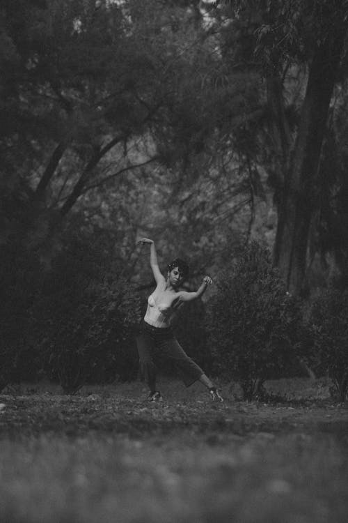 Free A Woman Dancing in the Forest Stock Photo