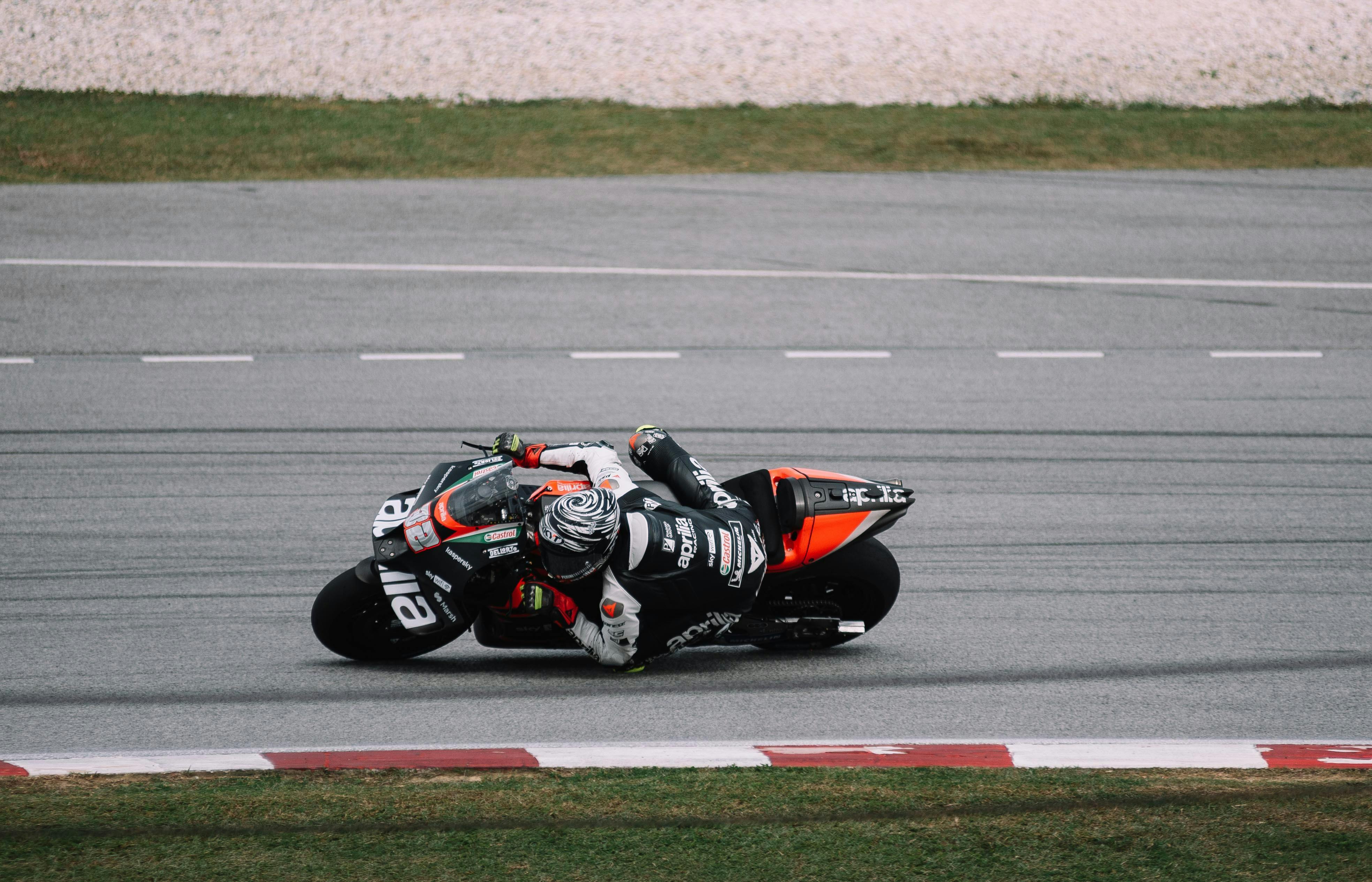 Free Professional motorcyclist in action on Sepang track. Dynamic and thrilling motorsport moment. Stock Photo