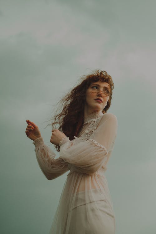 Redhead Woman in White Boho Dress