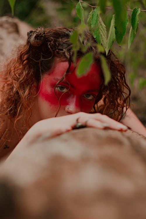 Woman in Red Face Paint