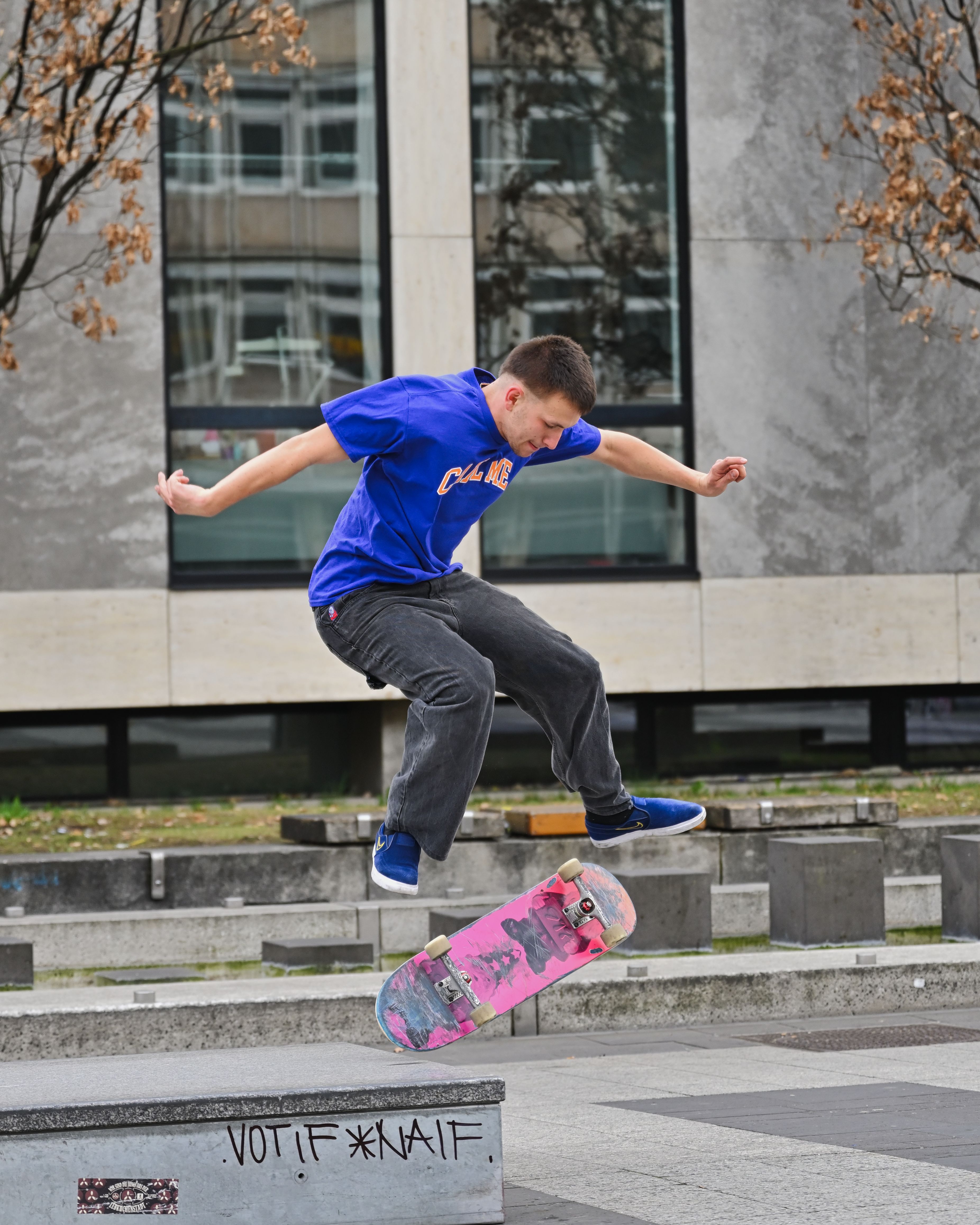 Young skater performs a trick outdoors in Nürnberg, Germany.