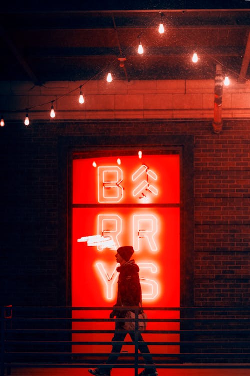 Man Walking outside a Building