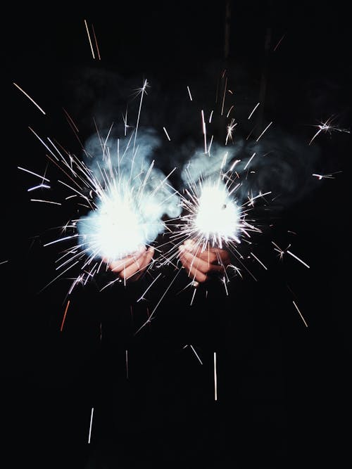 Free Photo of Person Holding Sparklers Stock Photo