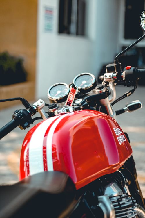 Free Close-up view of a red motorcycle with gauges and handlebars detailed. Stock Photo