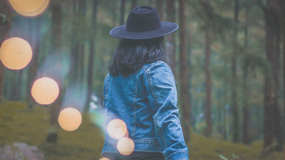 Photo of Woman Wearing Denim Jacket and Black Hat