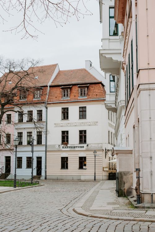 Free A picturesque cobbled street in Berlin with classic European architecture and historical buildings. Stock Photo