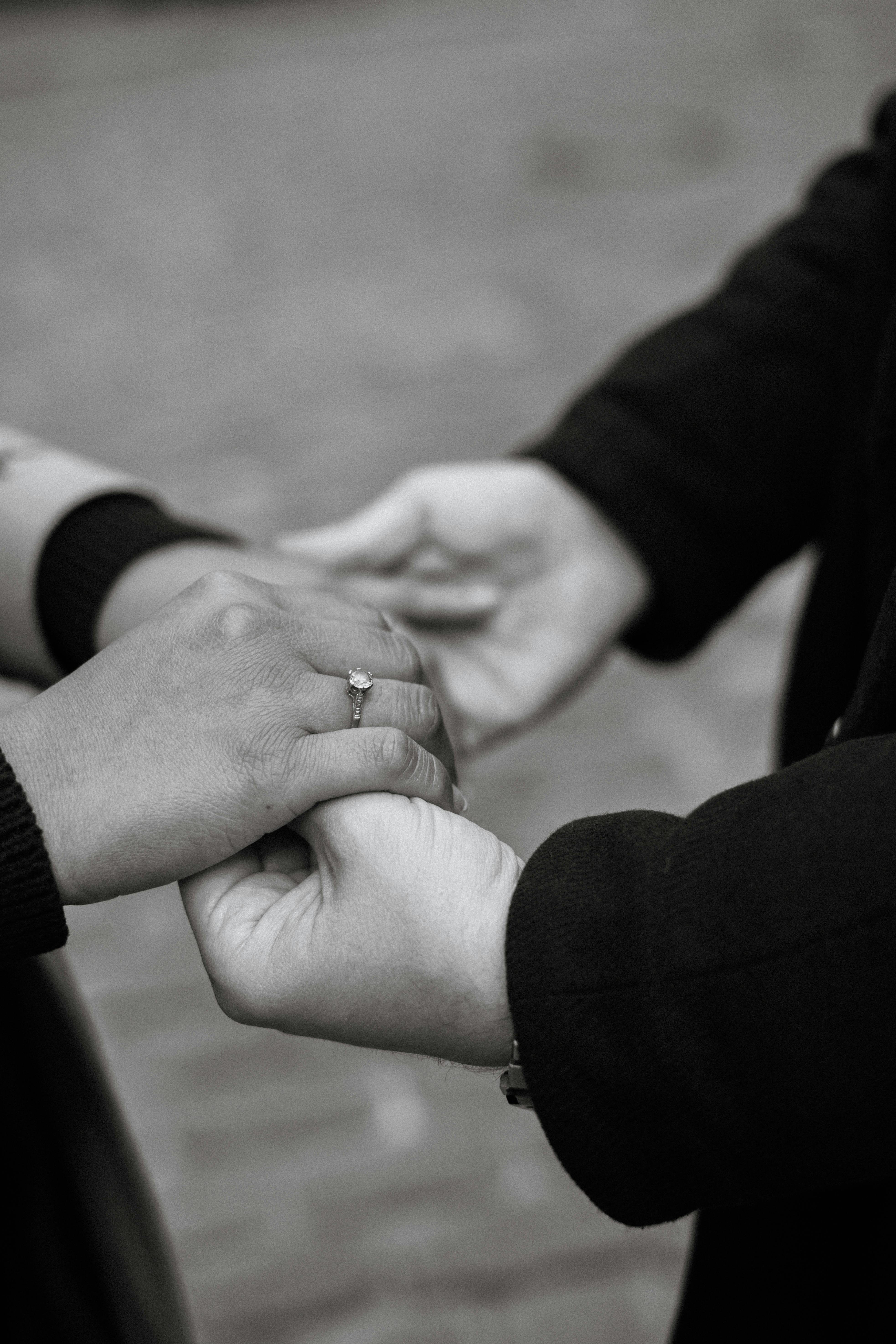 Couple holding hands grayscale romantic