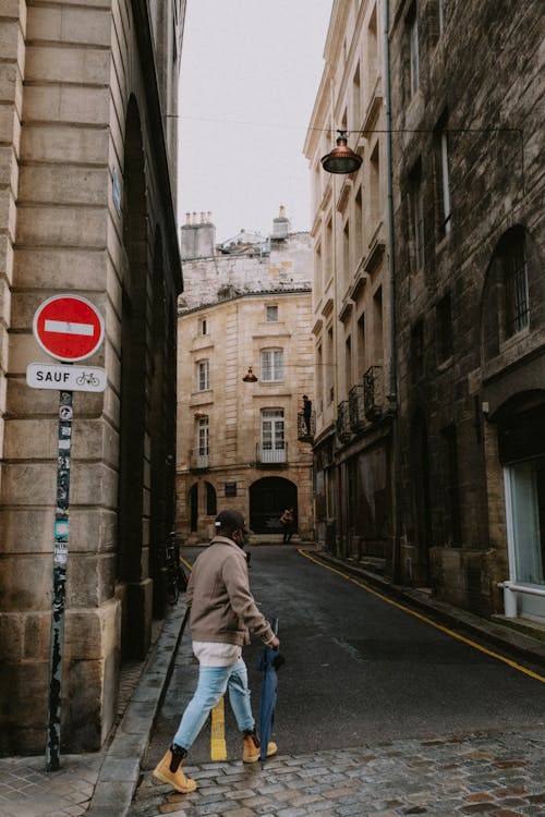 Man Walking on an Empty City Street