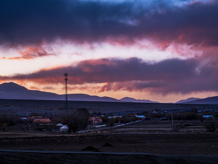 Clouds Over A Remote Town At Dusk