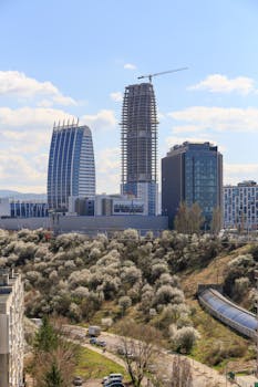 Stunning aerial view of Sofia's skyline featuring iconic skyscrapers and urban landscape.