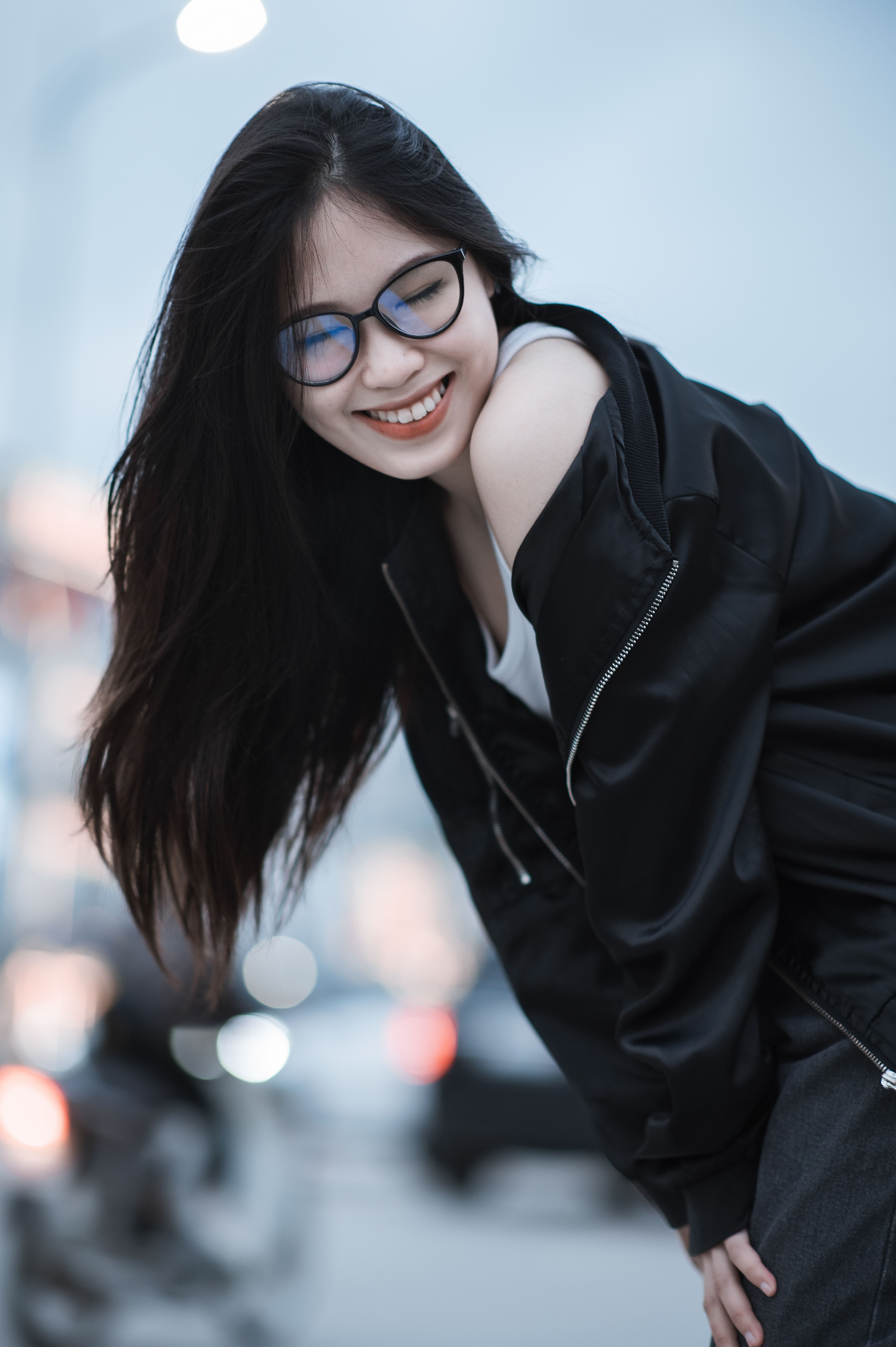 Close-Up Shot of a Woman in Black Leather Jacket Smiling · Free Stock Photo