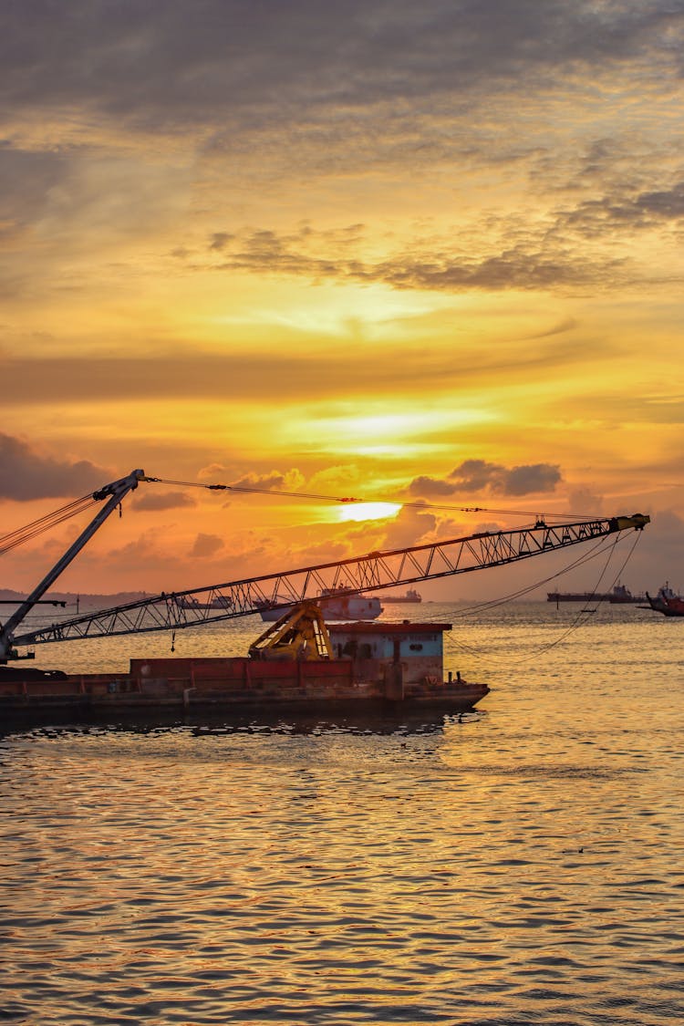 Industry Ship On A Sea At Sunset