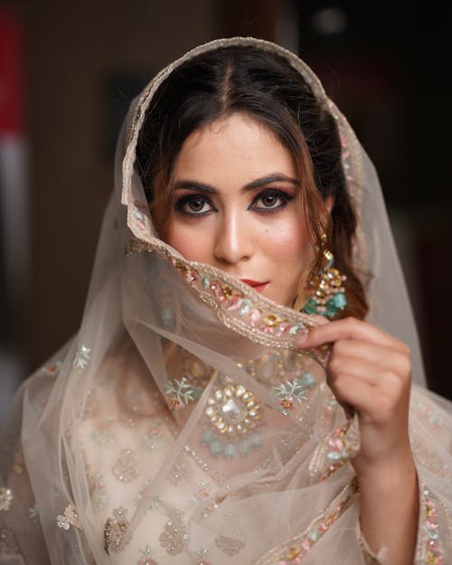 Woman in Beige Dress and Veil