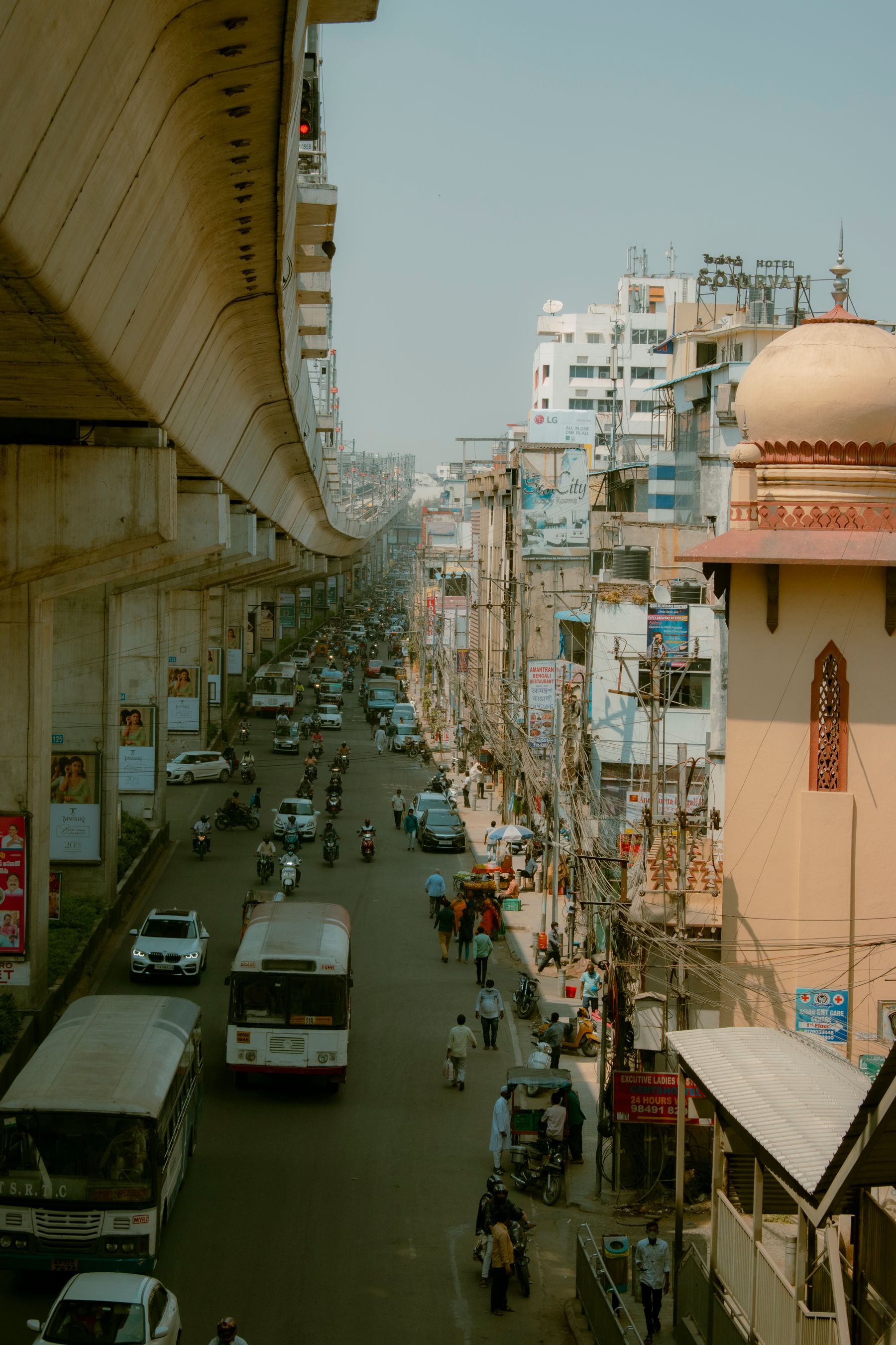 Busy urban street with traffic and people in Hyderabad