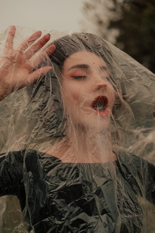 A Suffocating Woman Covered with Plastic