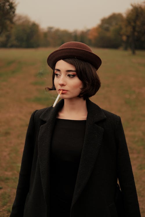 Woman in Coat with Cigarette