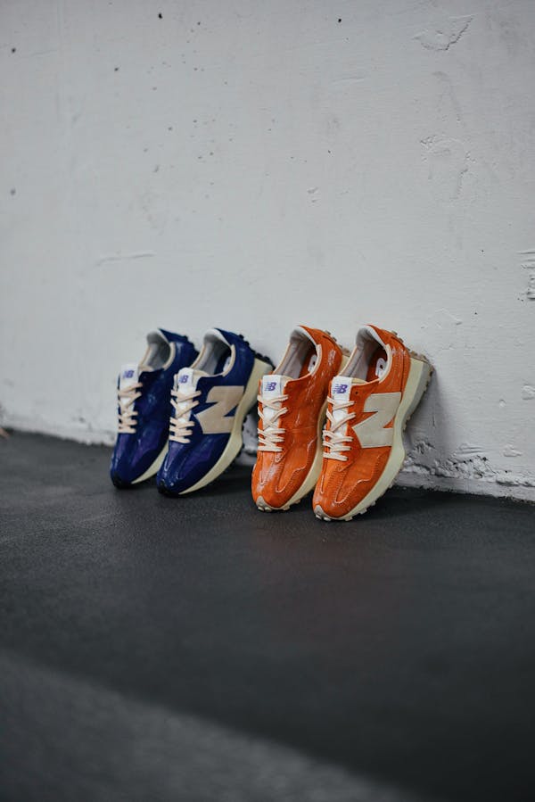 Two Pairs of Sports Shoes Leaning against a Wall