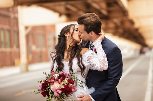 A Bride and Groom Kissing