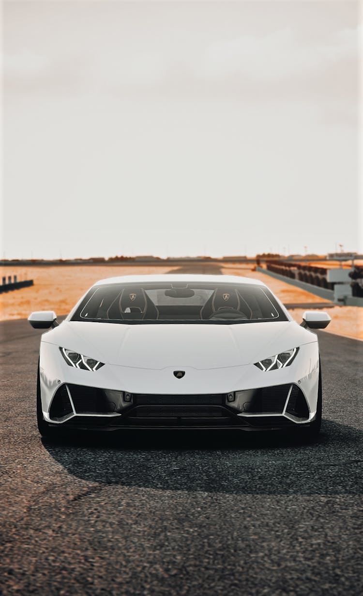 White Car Parked On Gray Asphalt Road