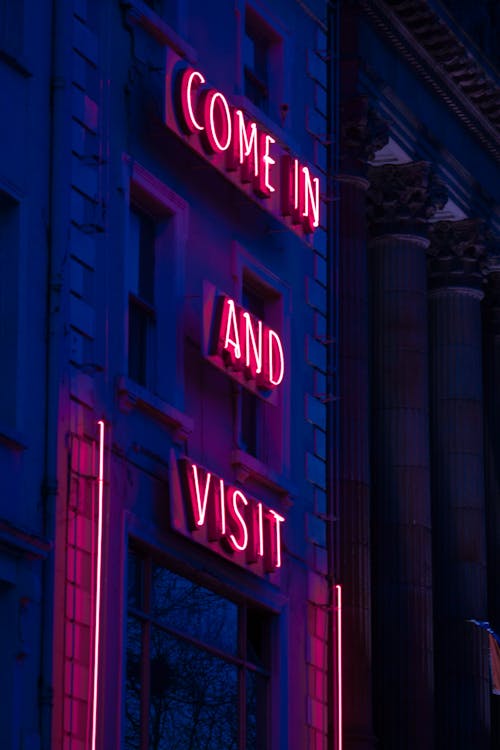 Free Neon Sign Outside a Building Stock Photo