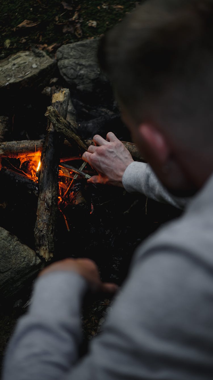 Man Starting Campfire 