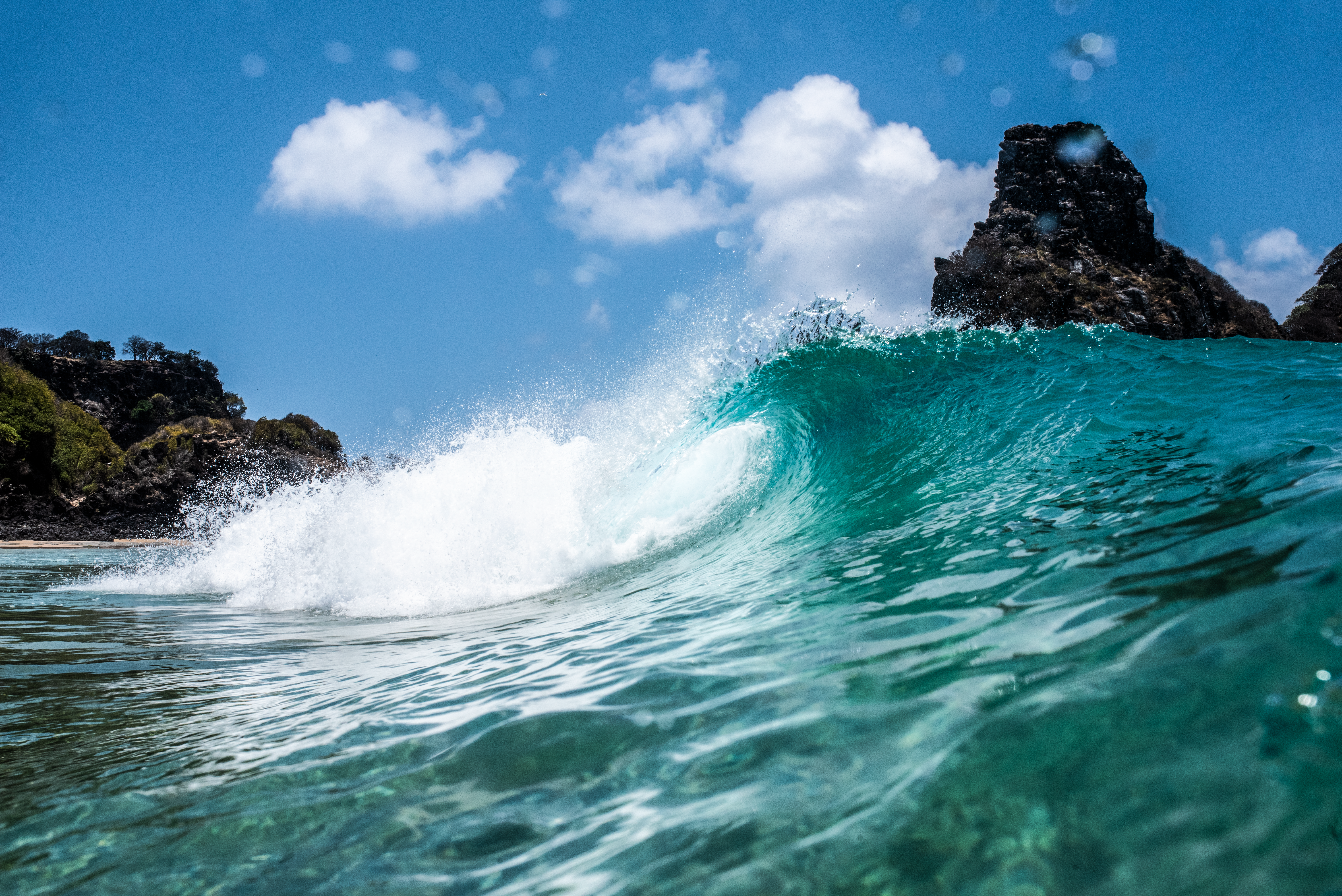 Stunning wave crashing on protected Brazil beach, capturing dynamic ocean energy and beauty.