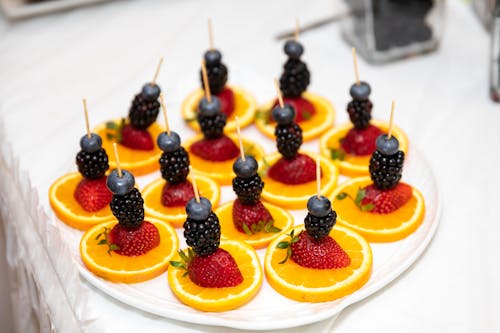 Sliced Oranges and Berries on a Plate