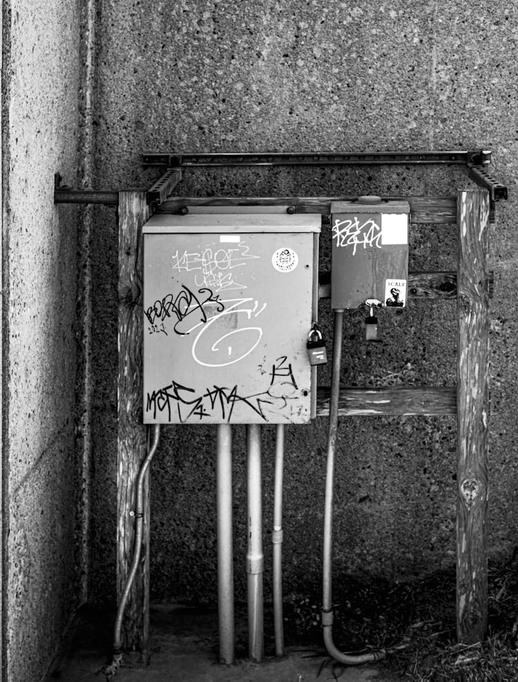Damaged Electrical Box On Building Wall