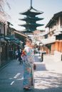 Japanese Woman Standing in the Middle of Street 
