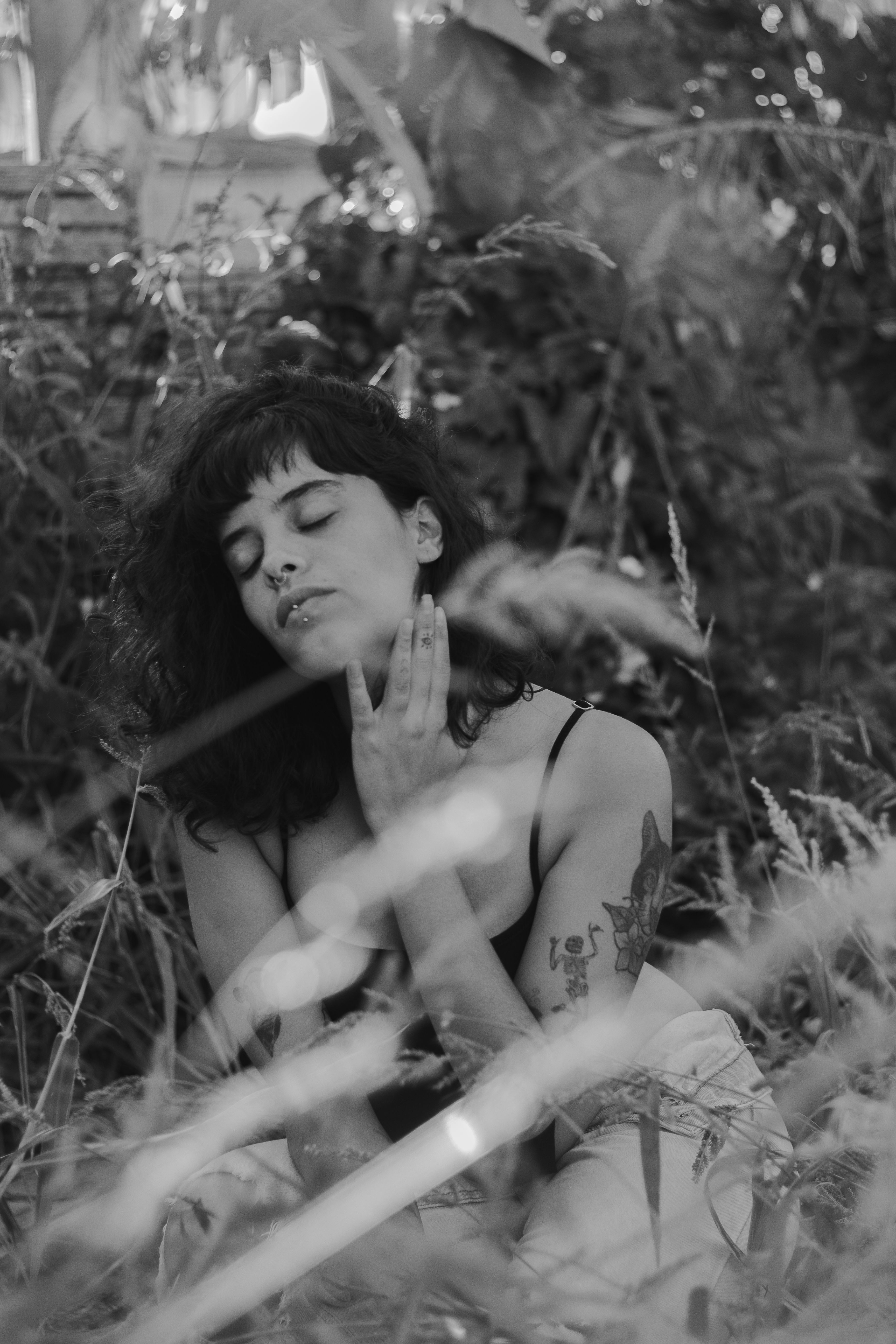 A Woman Touching her Neck While Eyes Closed · Free Stock Photo