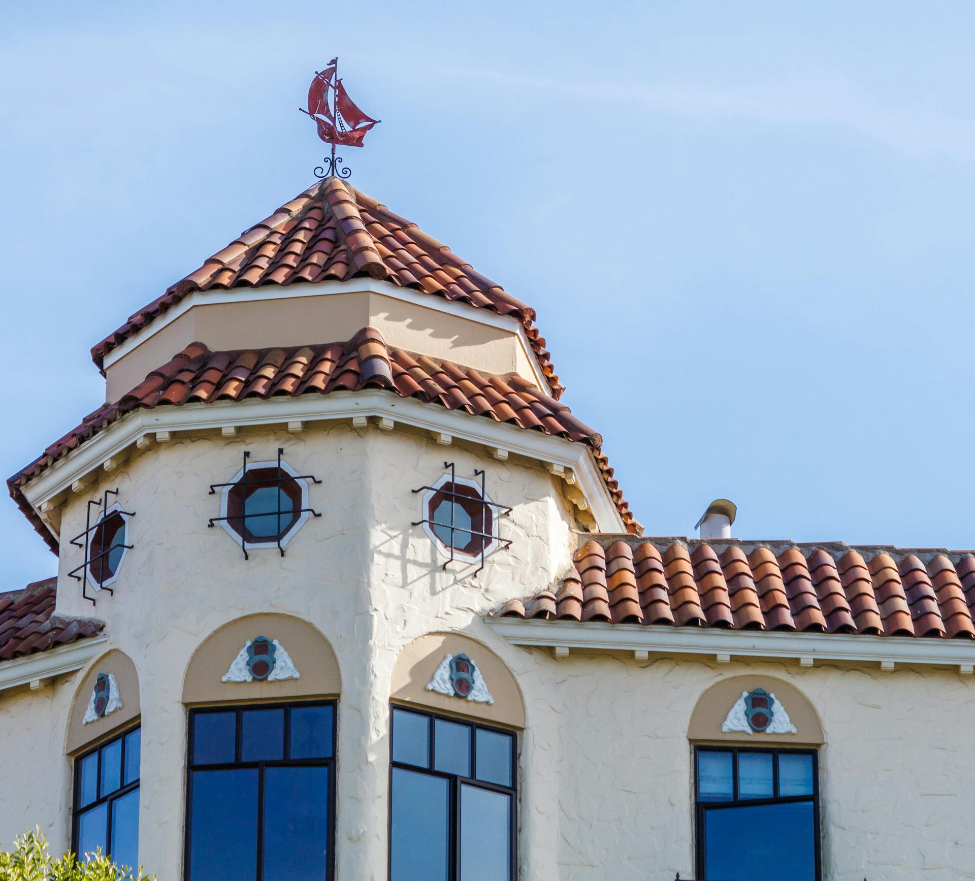 Tower with Ship Shape Wind Direction Indicator on a Tiled Roof