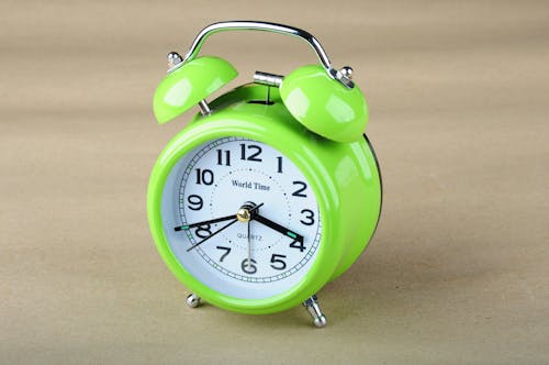 Free Close Up Photo of a Green  Alarm Clock Stock Photo