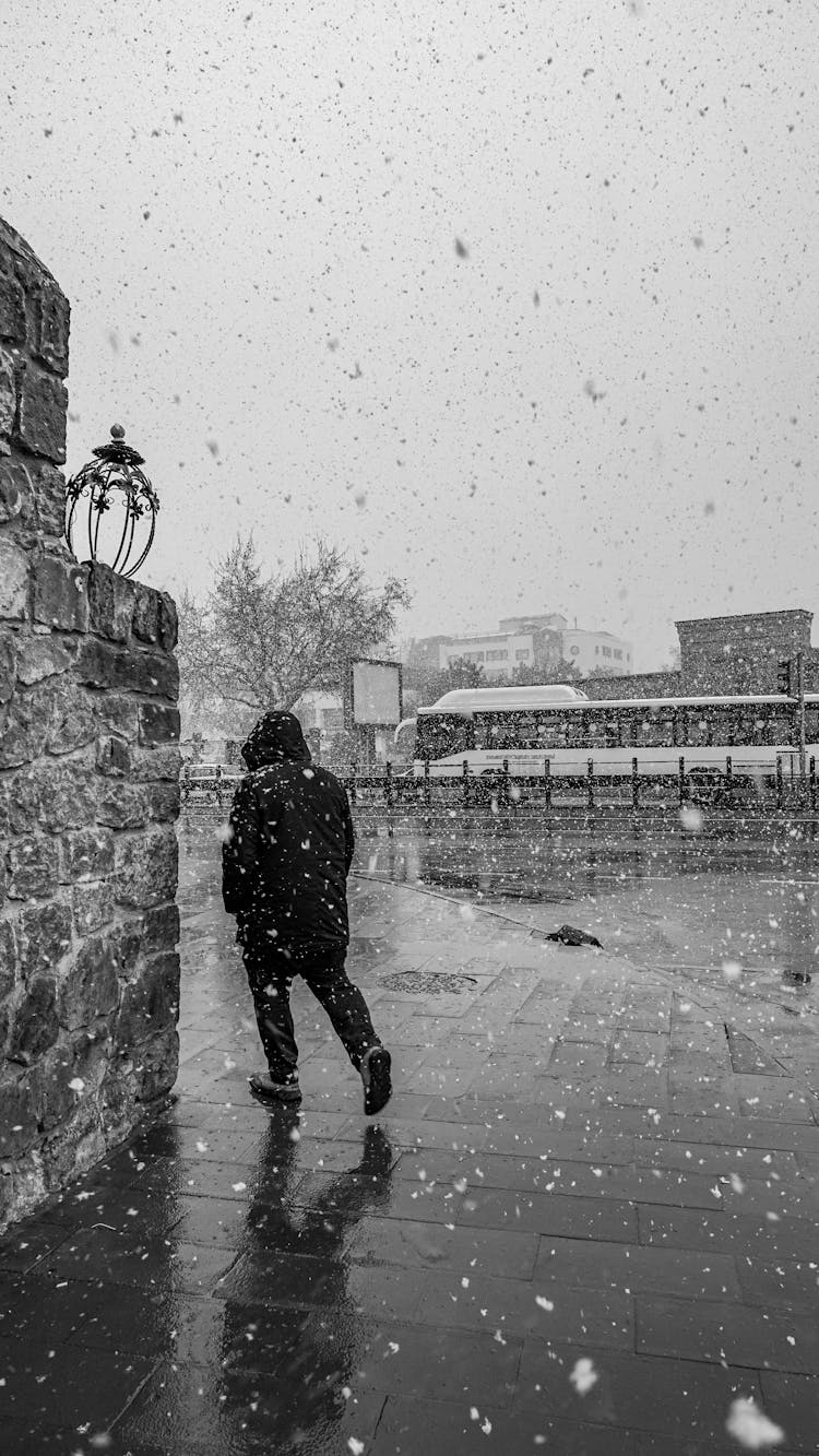 A Person Walking Turning Around A Corner