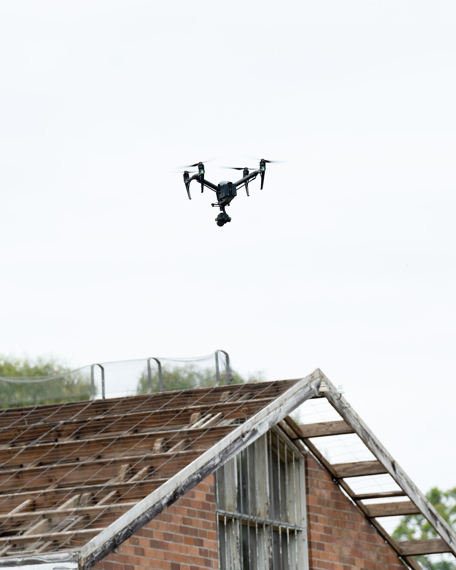 Drone flying over a roof for an aerial inspection