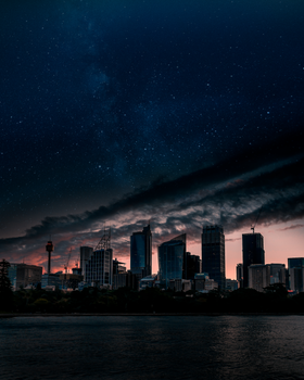 Stunning view of Sydney's skyline illuminated under a starry night sky.
