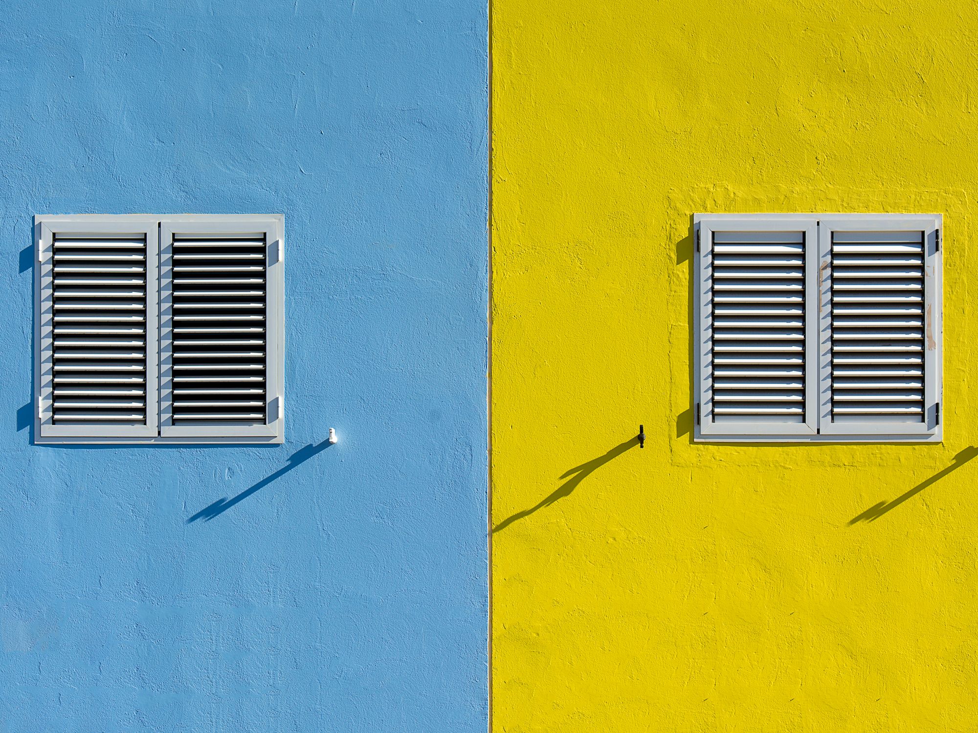 Painters & Decorators in Elmers End, London — professional decorator painting a wall with a roller