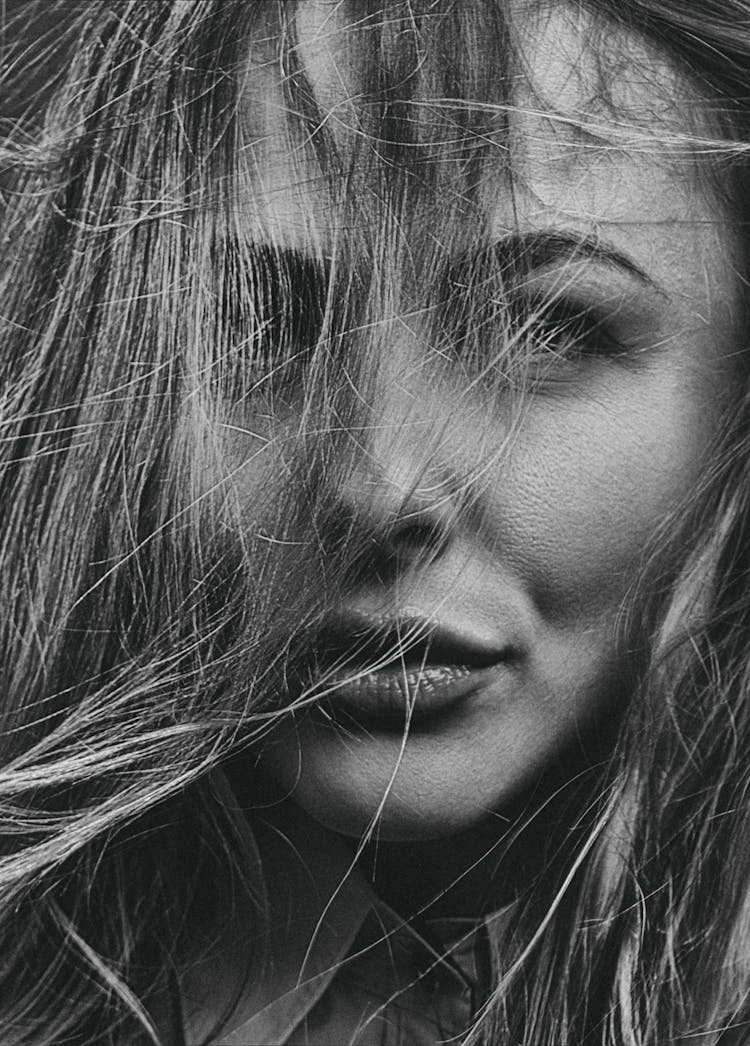 Close Up Photo Of Woman With Her Hair On Her Face