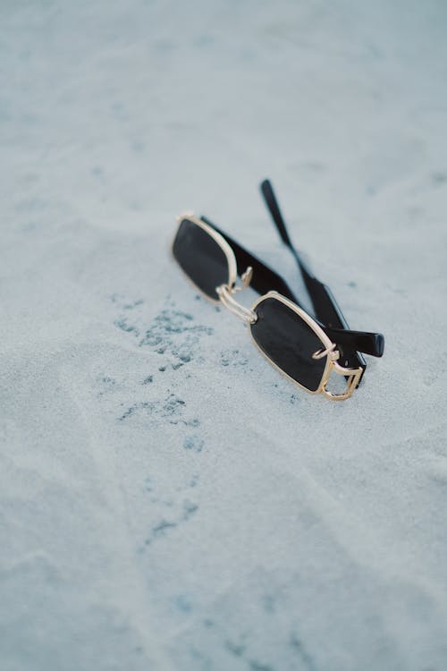 Close-up Photo of a Black Sunglasses with Gold Frame